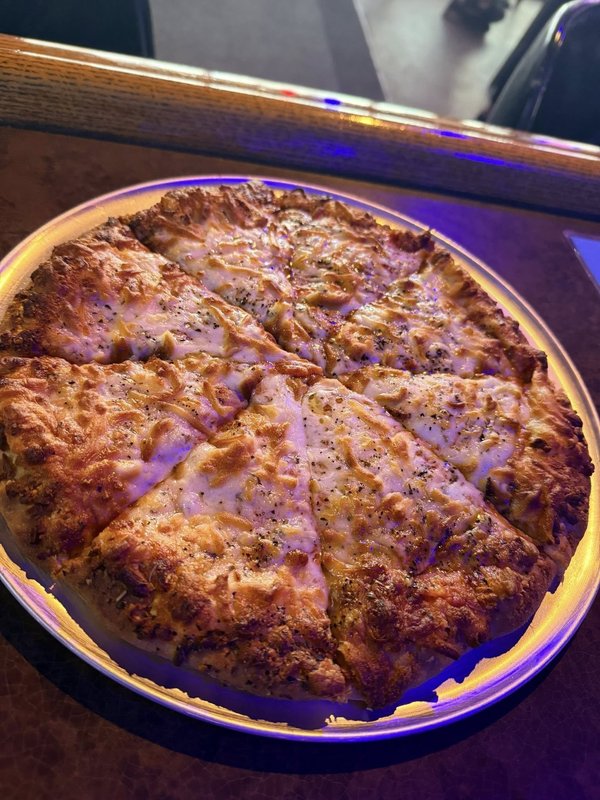 Fresh pizza under the bar lights